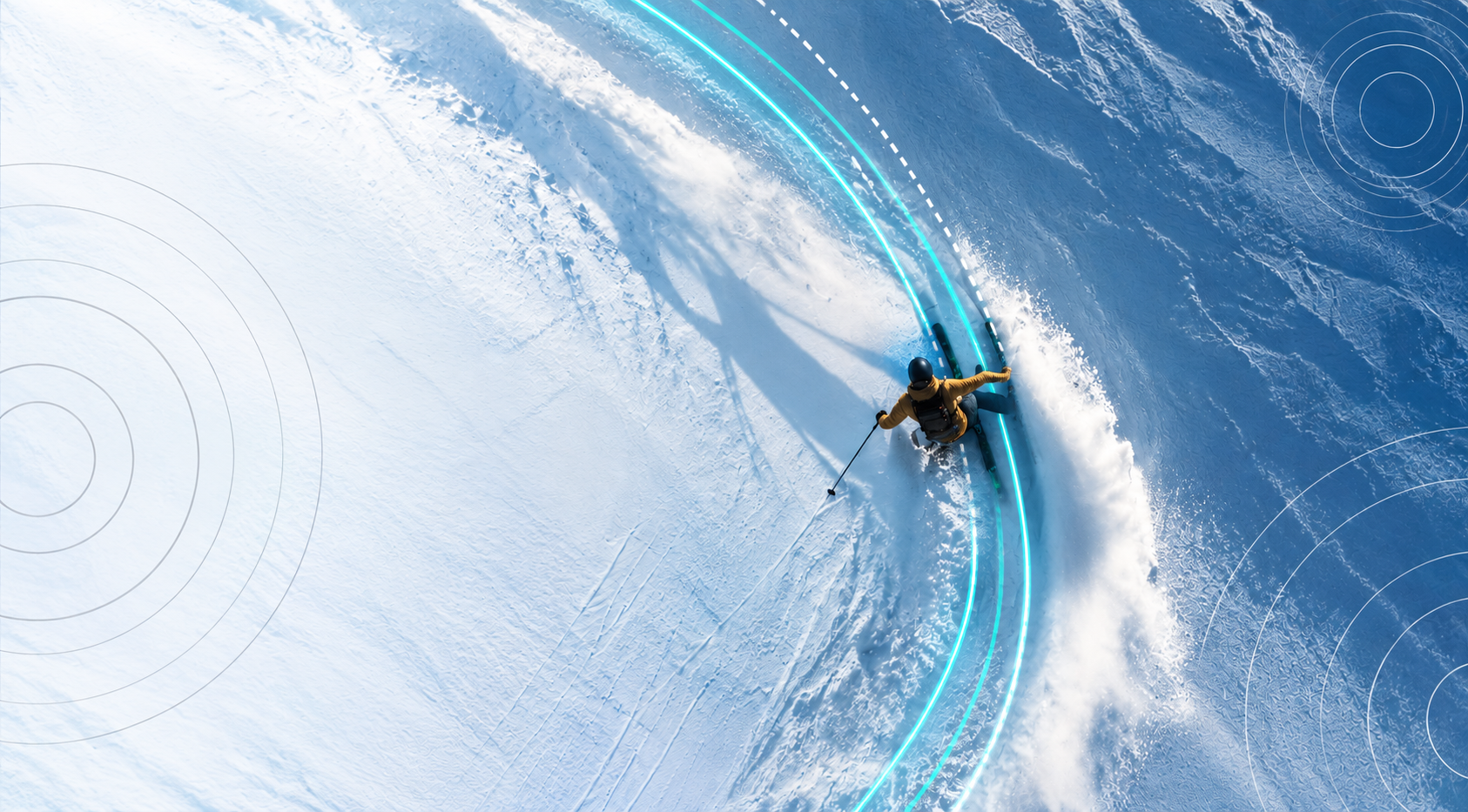 Aerial view of skier carving with glowing pulse ski trail