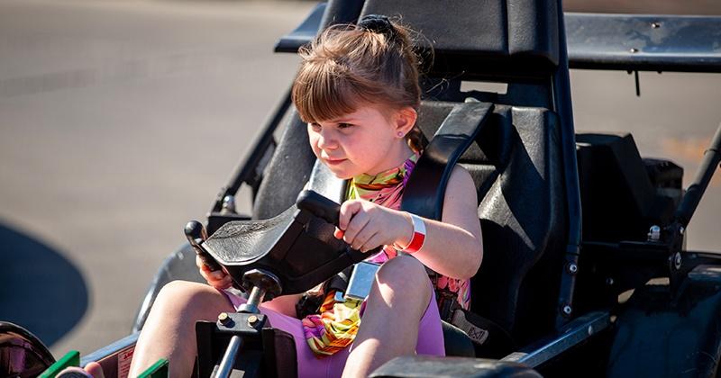 girl driving go kart on Qualifier track