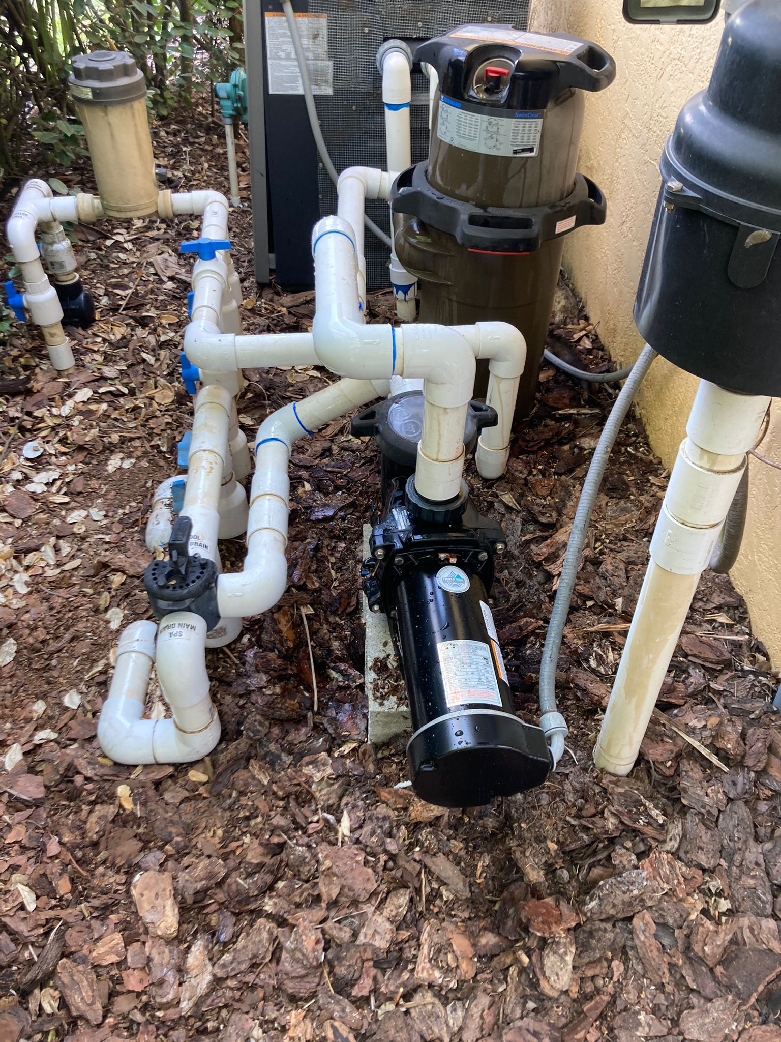 Residential pool pump replacement and suction plumbing manifold