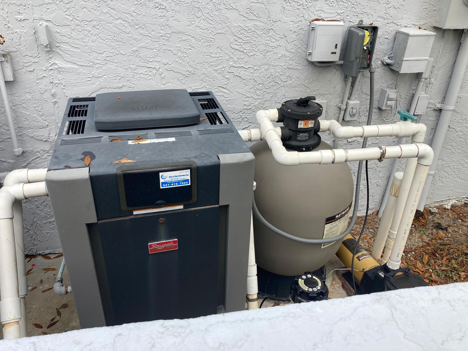 Raypak residential gas pool heater installation with Hayward filtration system