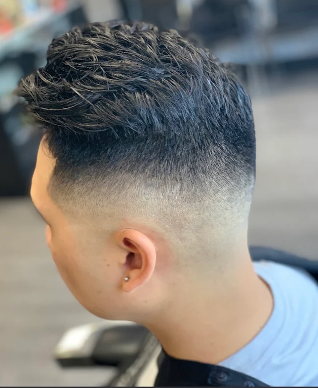 Textured crop style with clean high skin fade — House of Haze