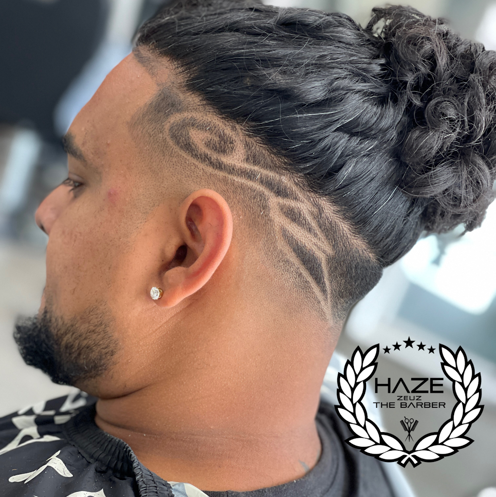 Freestyle hair design with skin fade & bun by Haze Zeuz the Barber — House of Haze