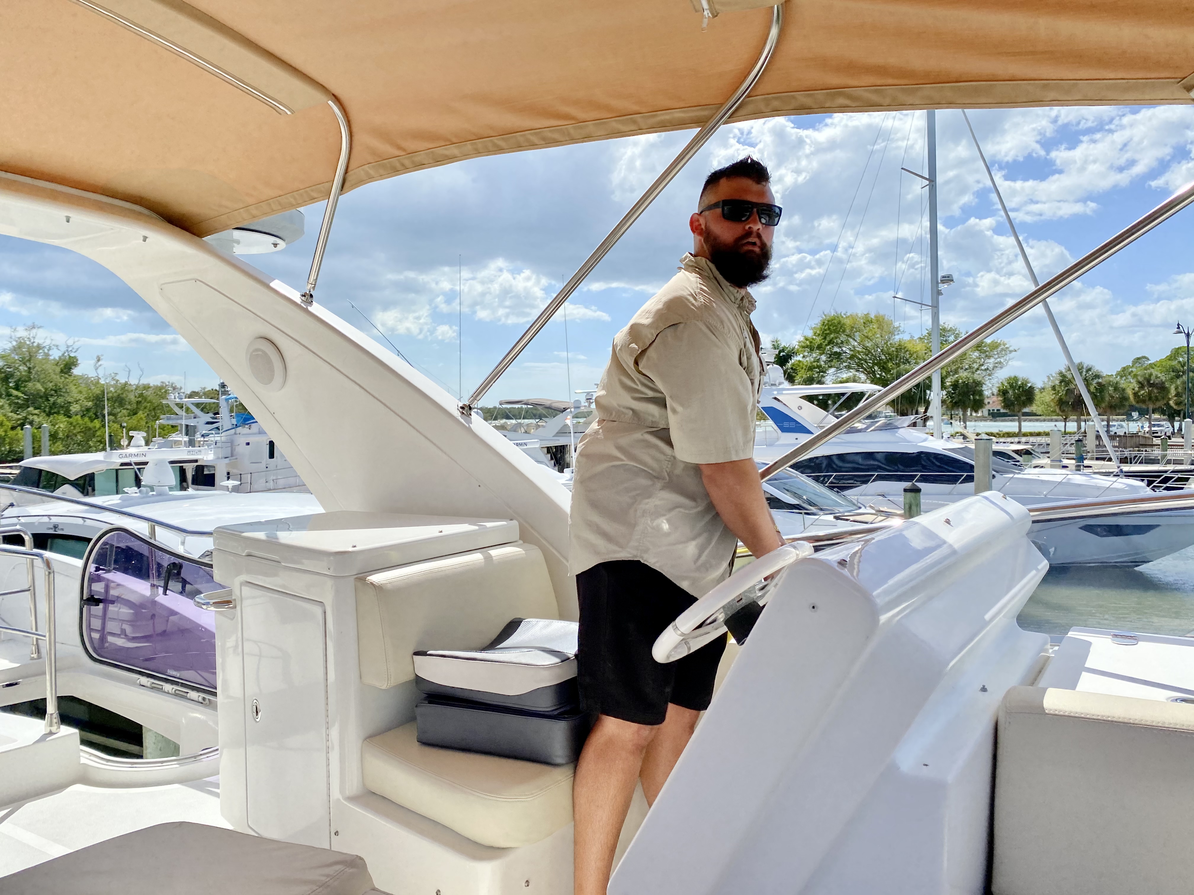 Joseph Federico at the helm of a yacht underway