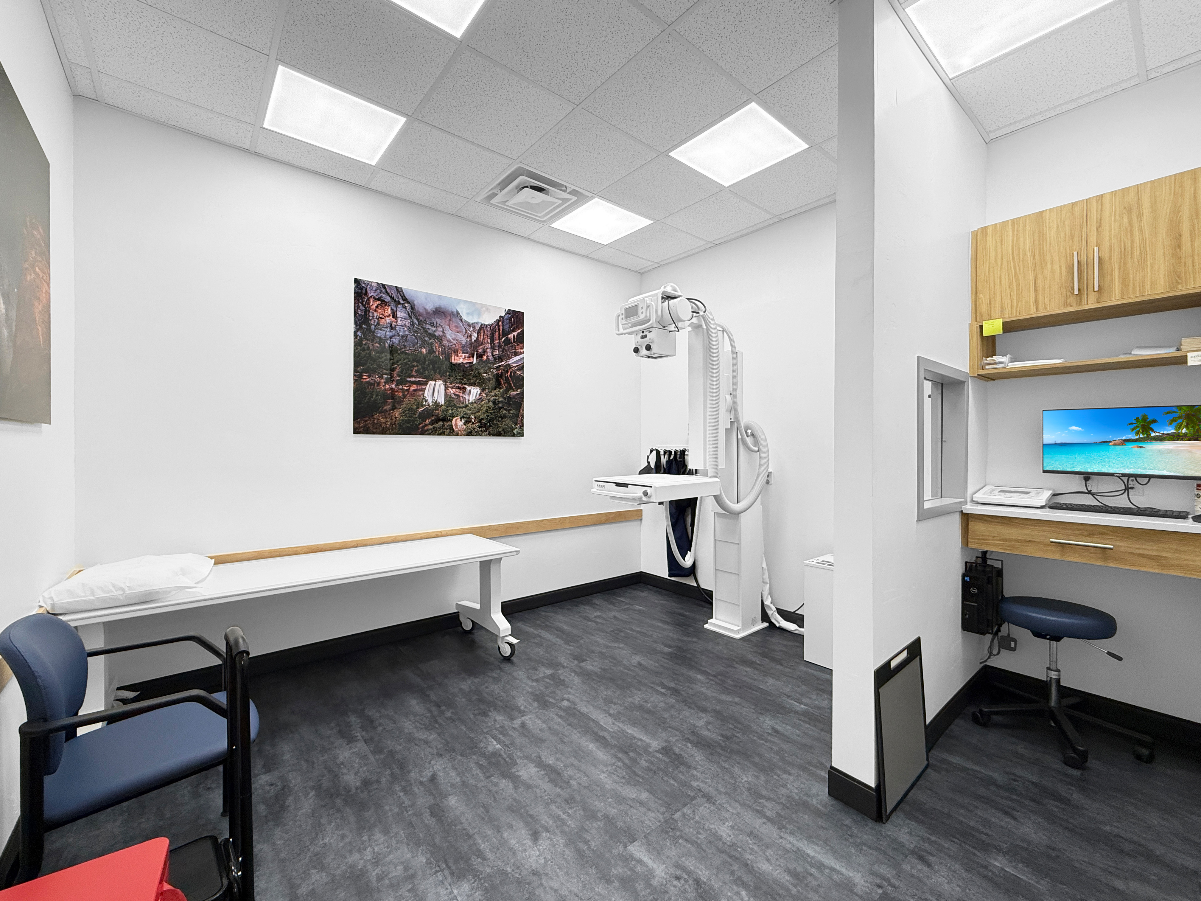 Digital radiography and X-ray imaging suite with diagnostic table and technician workstation