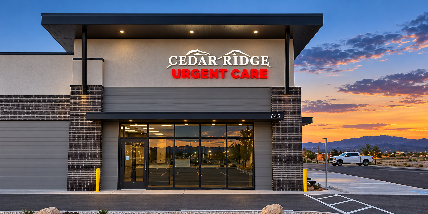 Exterior of Cedar Ridge Urgent Care clinic entrance with dimensional signage and brick columns at sunset in Cedar City, Utah