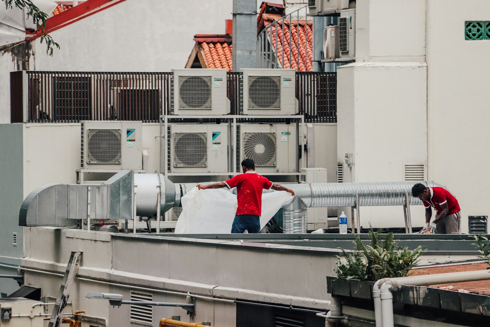 HVAC technician servicing air conditioning equipment