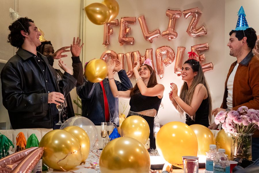 Joyful birthday celebration with balloons and friends