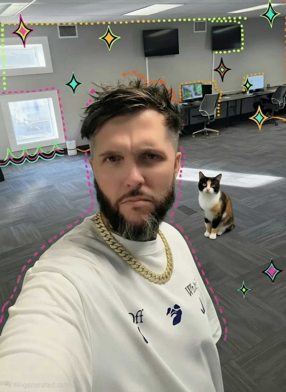 Chris Wilson selfie in the Performance Local office with a calico cat.