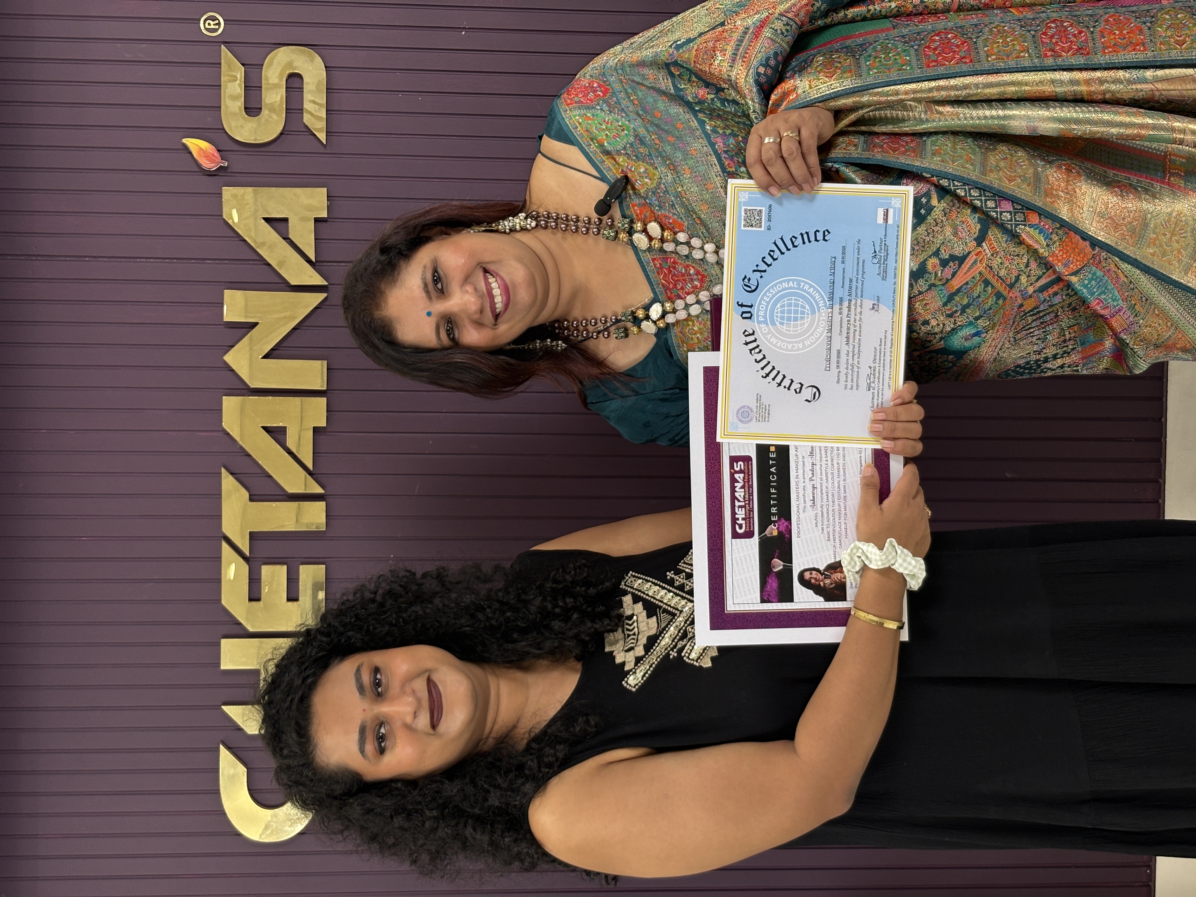 Student holding Certificate of Excellence with founder Mrs. Chetana Salian