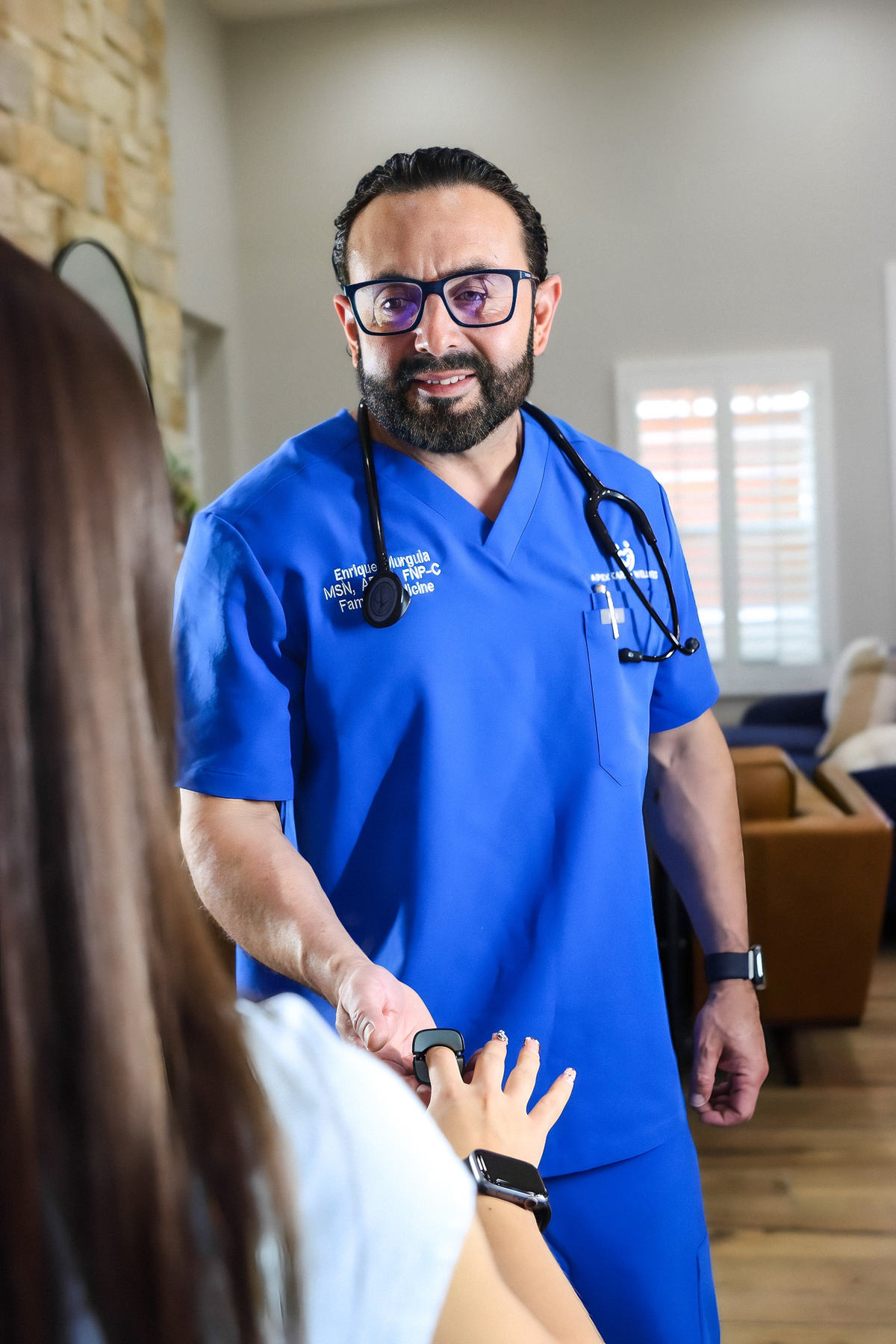 Enrique Murguia, FNP-C greeting a patient for hormone optimization consultation