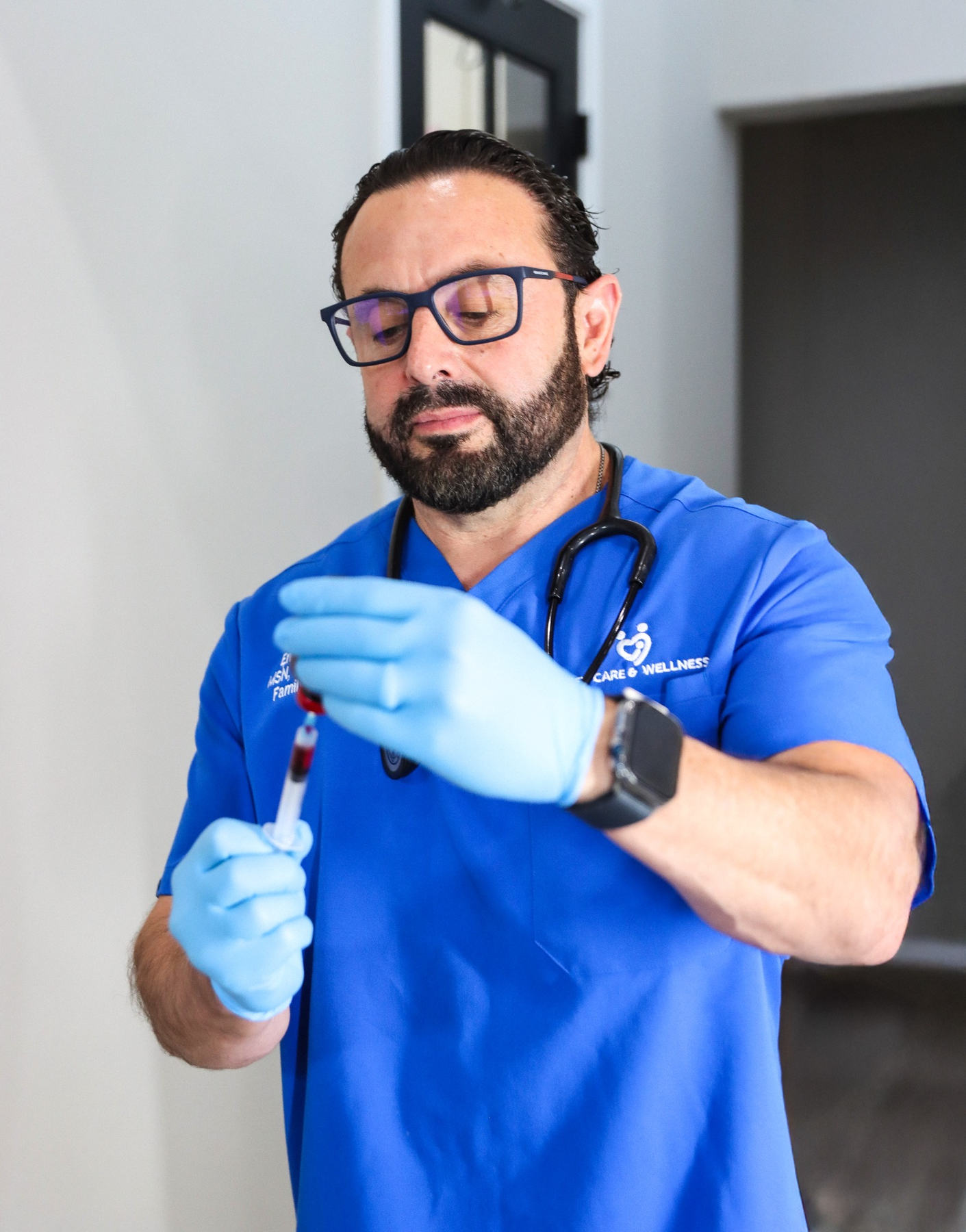 Enrique Murguia, FNP-C holding clinical chart for medical weight management