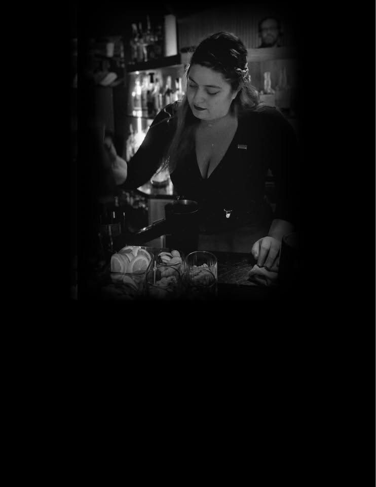 Stir Crazy Co. mixologist behind the bar crafting artisan drinks