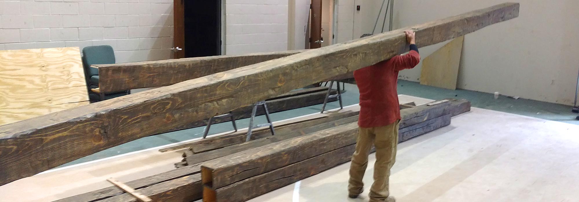 Hand-hewn barn box beams installed in a finished room
