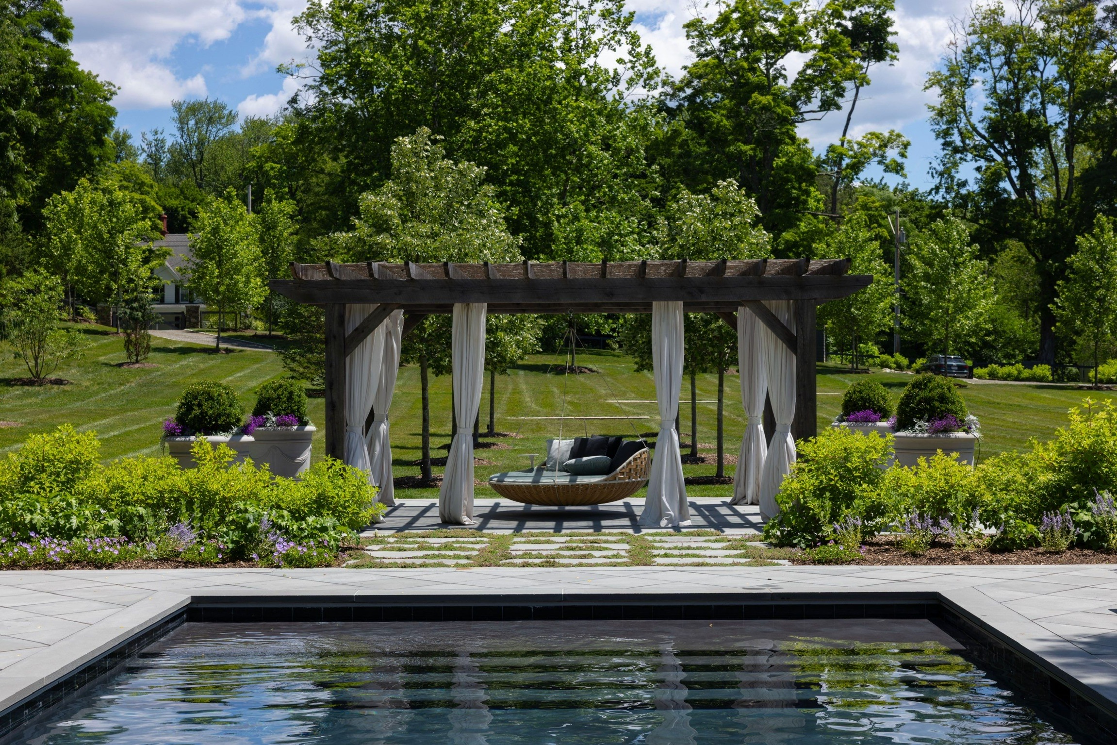 Custom pergola and patio installation in Rhinebeck, NY by Red Cedar Construction