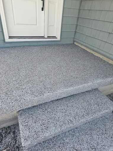 Hudson Epoxy Flooring completed gray decorative flake coating on exterior front door landing and entryway steps