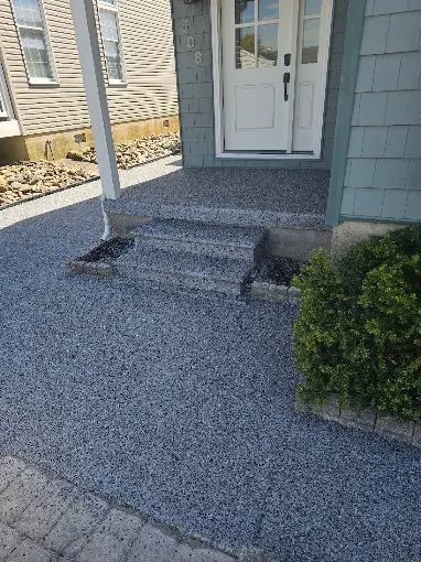 Hudson Epoxy Flooring completed exterior decorative flake coating on residential front porch entryway, walkway, and concrete steps