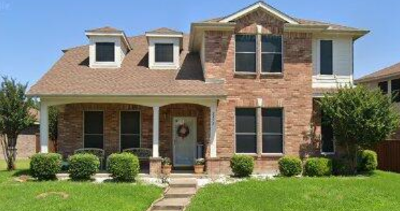 2952 Gospel Drive, Dallas — a two-story brick home at golden hour