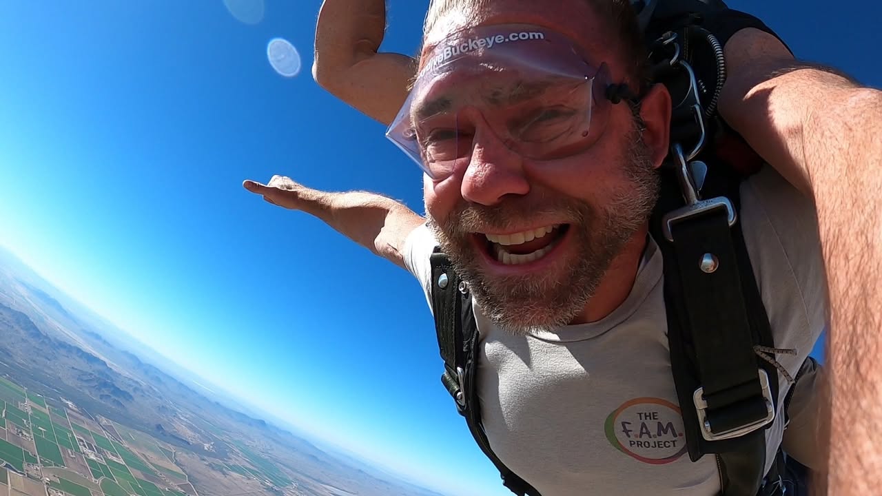 Jashin Howell skydiving in a FAM Project shirt