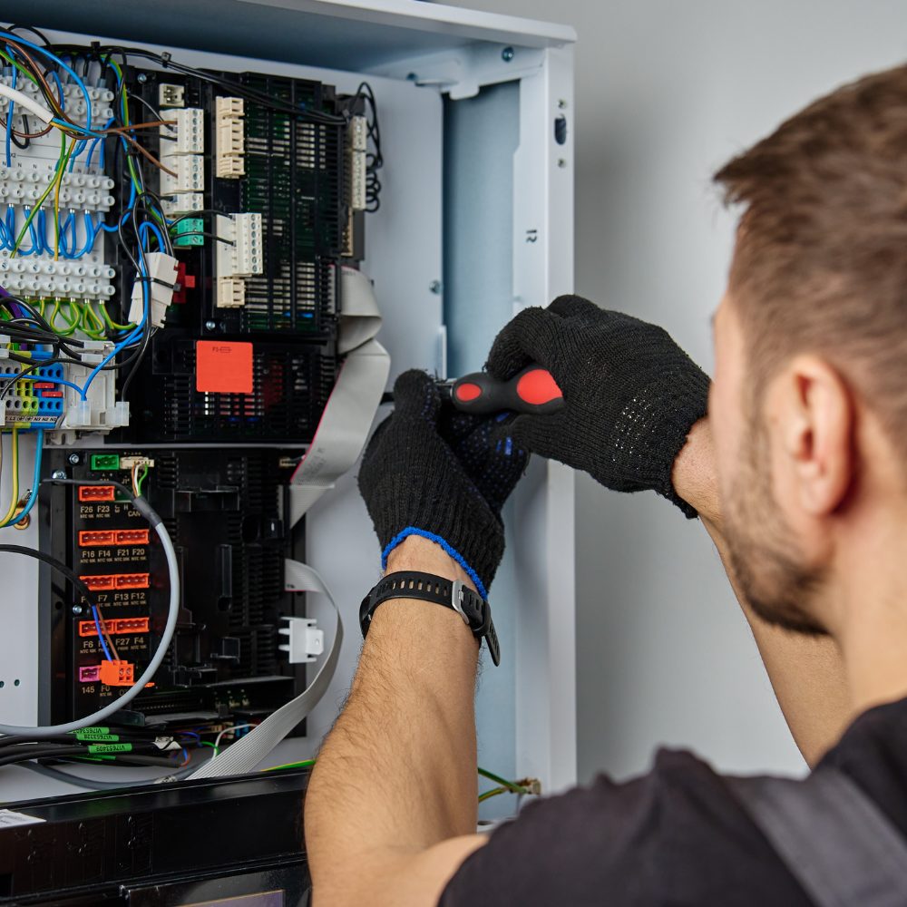 Electrician working on an electrical panel