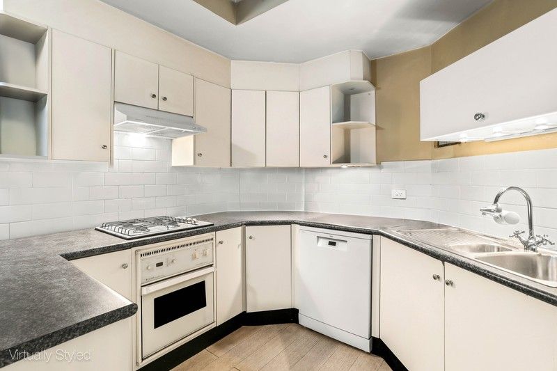 Surry Hills kitchen before renovation, dated laminate and tiled splashback