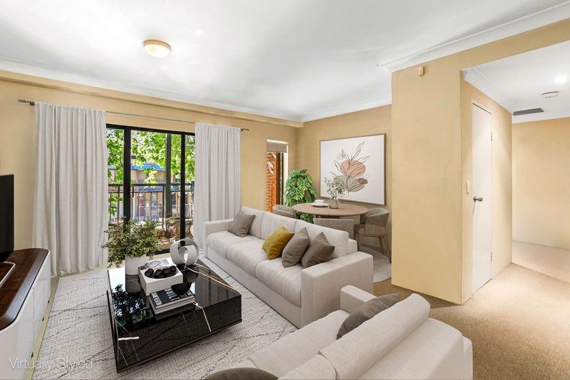Surry Hills living room before renovation, dated cream paint and carpet