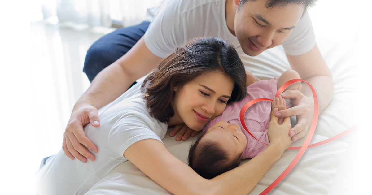 Mom and Dad cuddling their newborn baby safe and protected