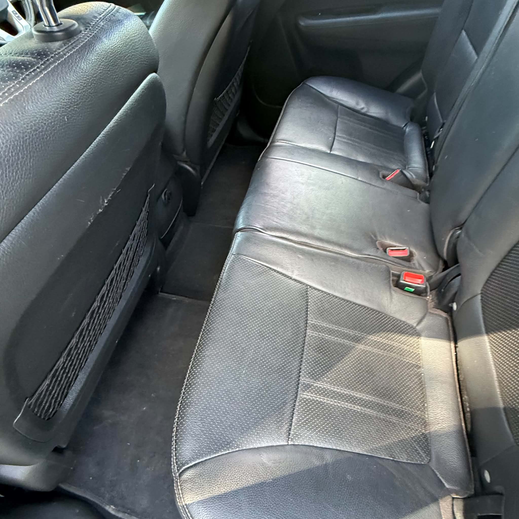 Car interior after detailing in Maitland — back seat and floor carpet steam-cleaned and restored to a spotless, like-new finish by Detail Your Ride