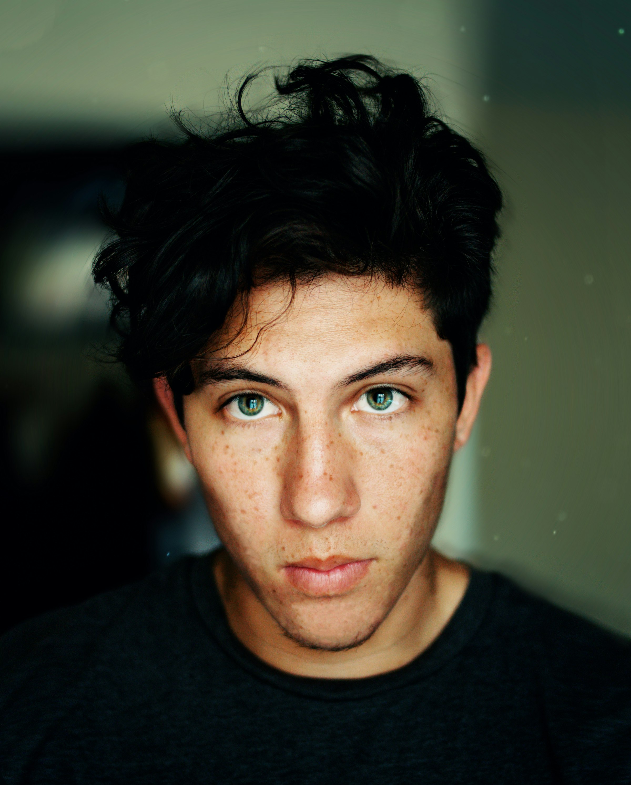 A confident person photographed in low light