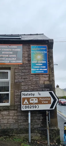 Exterior sign for Glow TTR Kirkby Stephen at Skywalk House on South Road