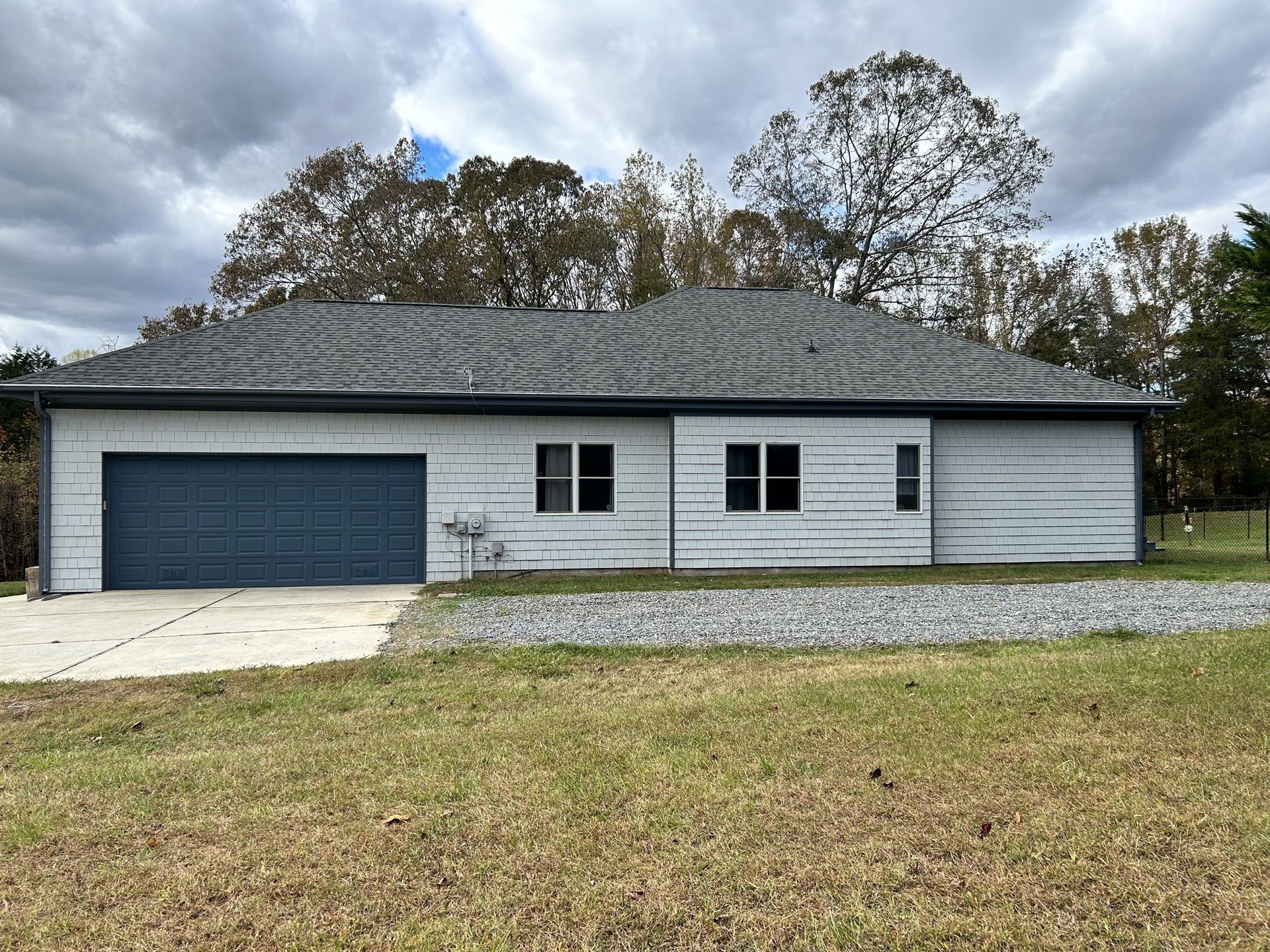 Ranch exterior in Huntersville — garage side after painting