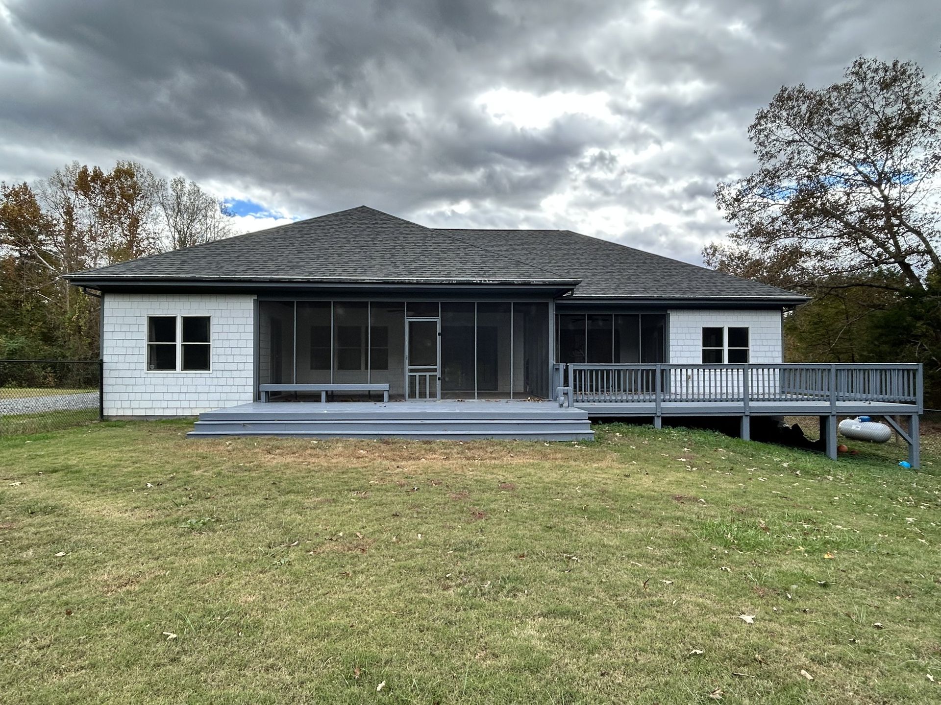 Ranch exterior in Huntersville — rear deck and screened porch after painting