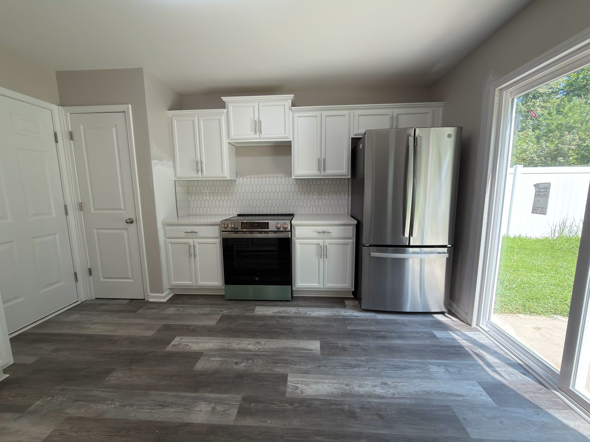 Broad Valley kitchen in Charlotte after cabinet painting, new counters and flooring