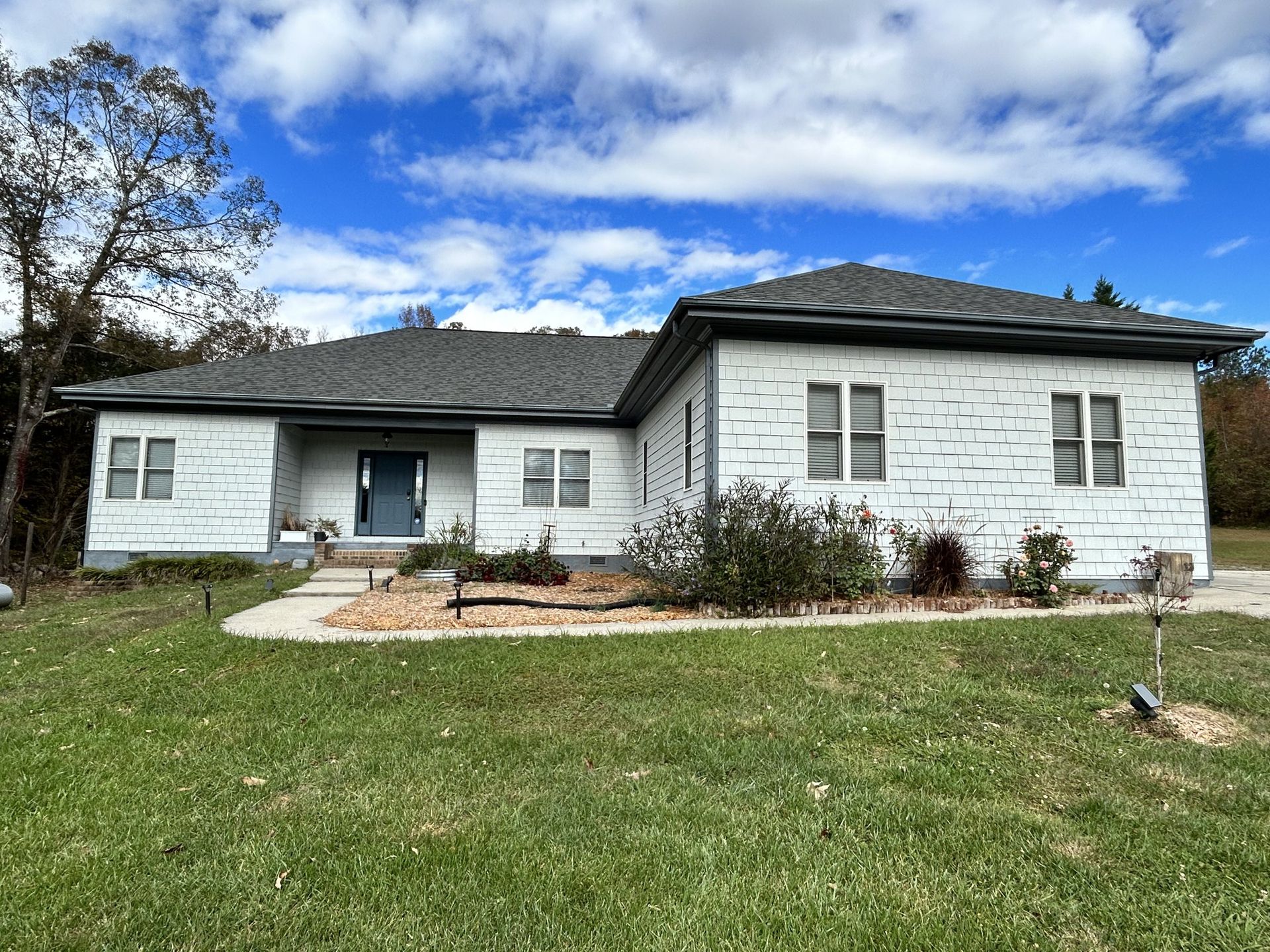 Ranch exterior in Huntersville — front, after painting siding and the front door