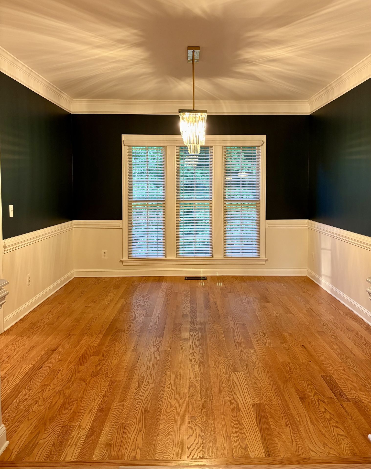 Forest Walk dining room in Mooresville after interior painting and a new light fixture