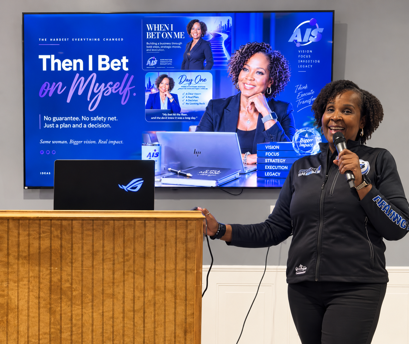 Gwendolyn V. Arrington delivering a presentation with a microphone.