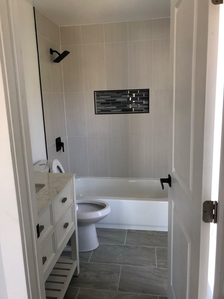 Custom Tile Bath Retreat with Accent Niche — Bathrooms