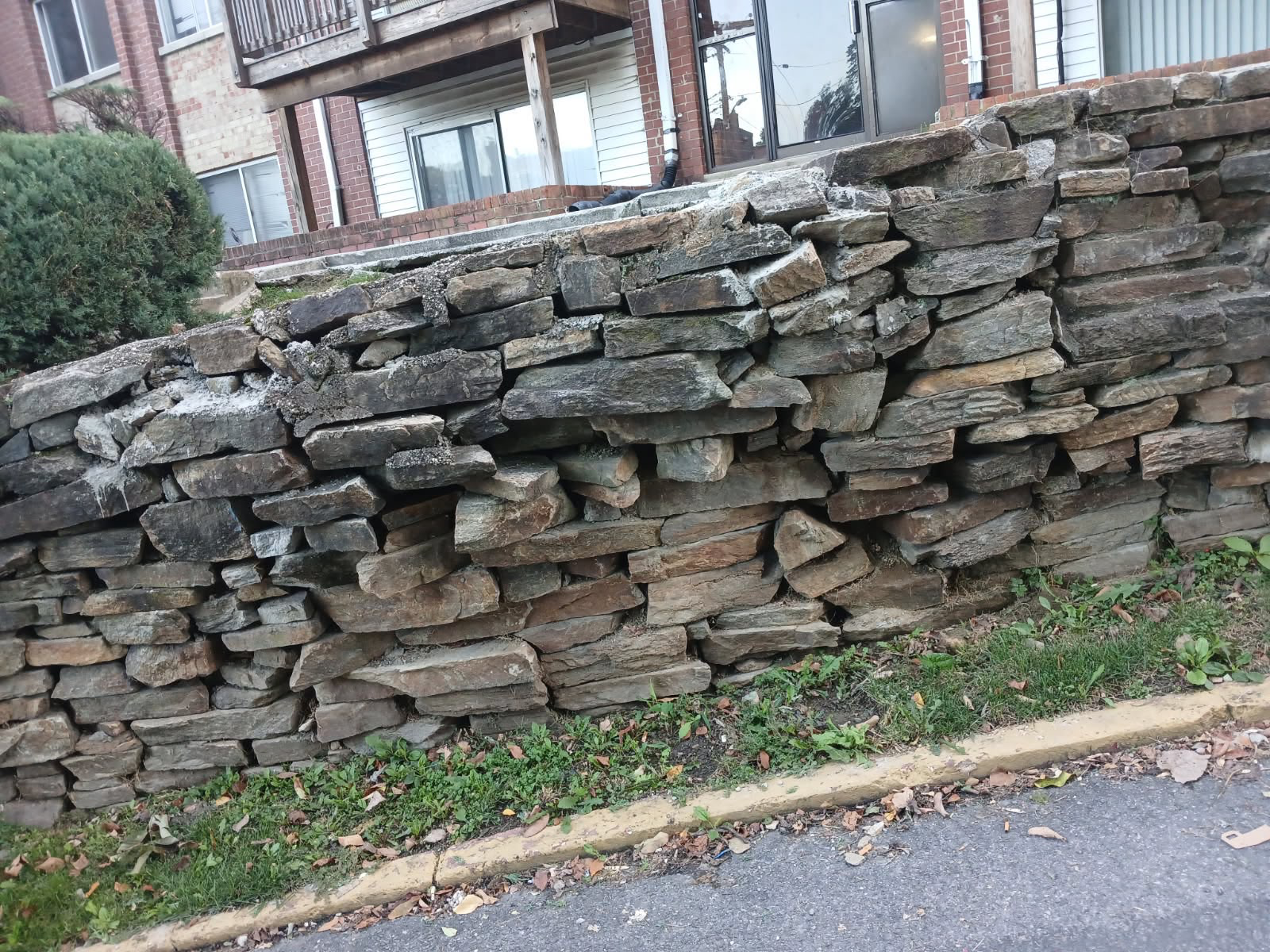 Natural Stacked Stone Retaining Wall Masonry — Stone Work