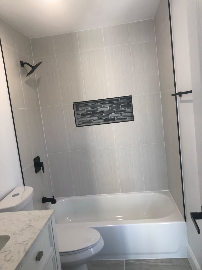 Modern Bathroom Renovation with Matte Black Fixtures — Bathrooms