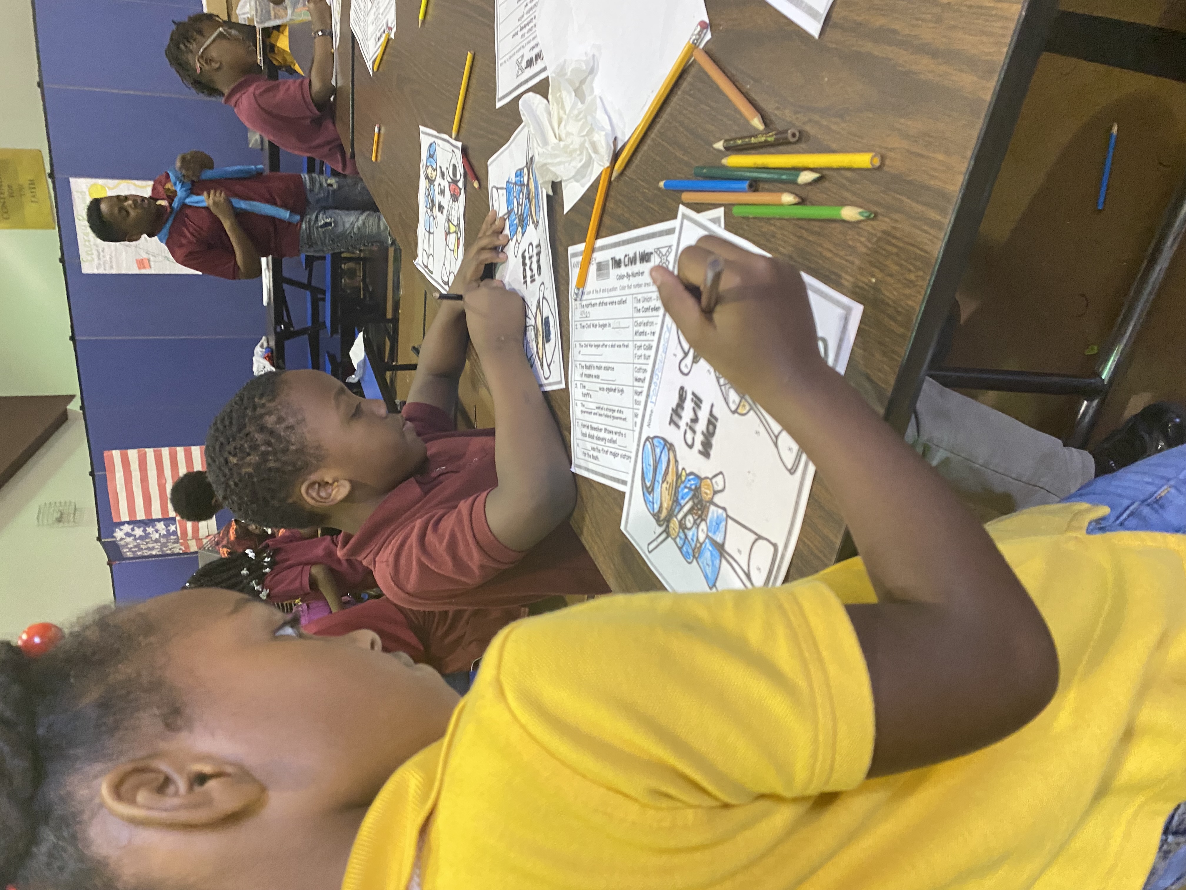 Students engaged in classroom learning and coloring lessons at Grant Park Christian Academy