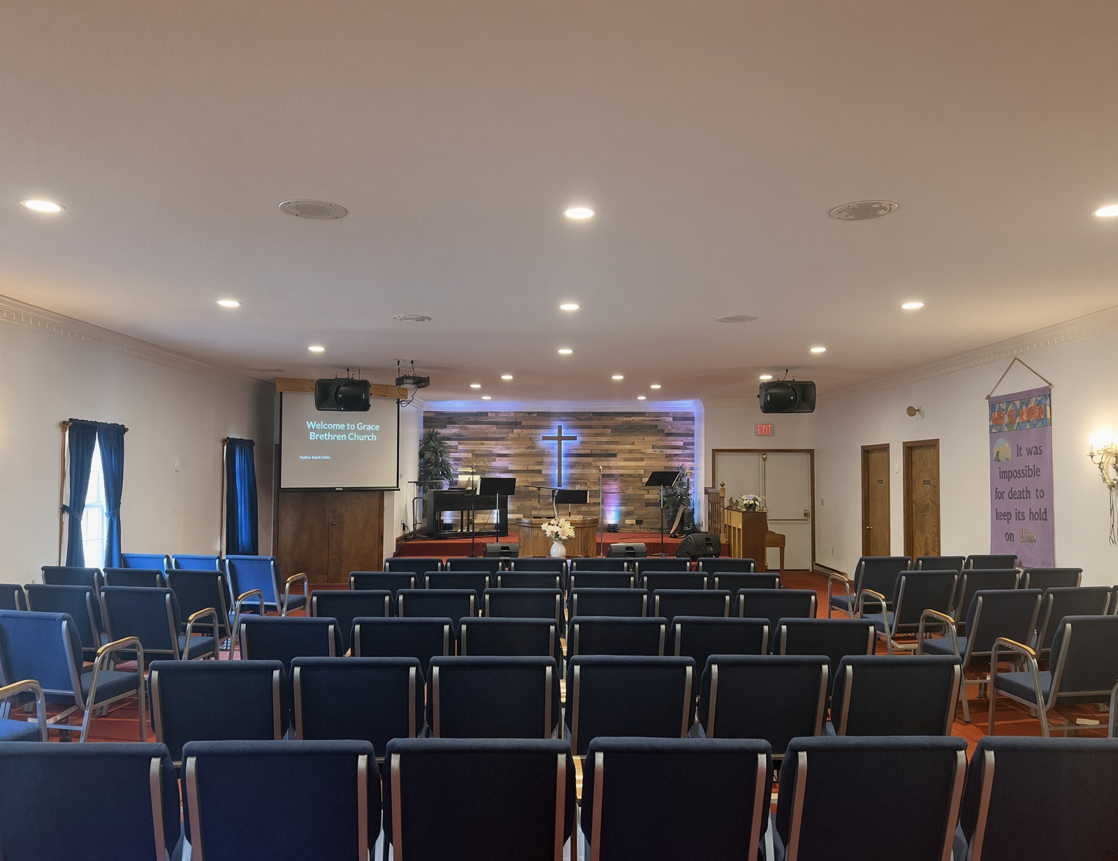 The warm, light-filled sanctuary of Grace Brethren Church