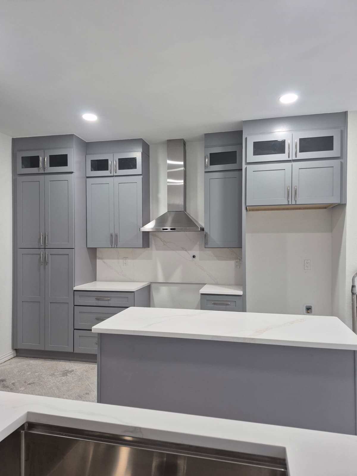 Gray Shaker Cabinetry & Stainless Vent Hood — Kitchens by Sevilla Remodeling LLC