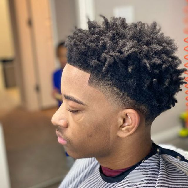Twist sponge curls with low drop fade and sharp temple line-up
