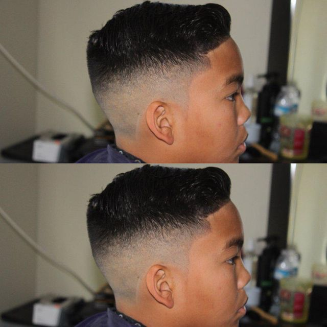 Clean mid skin fade haircut with styled top and sharp temple line