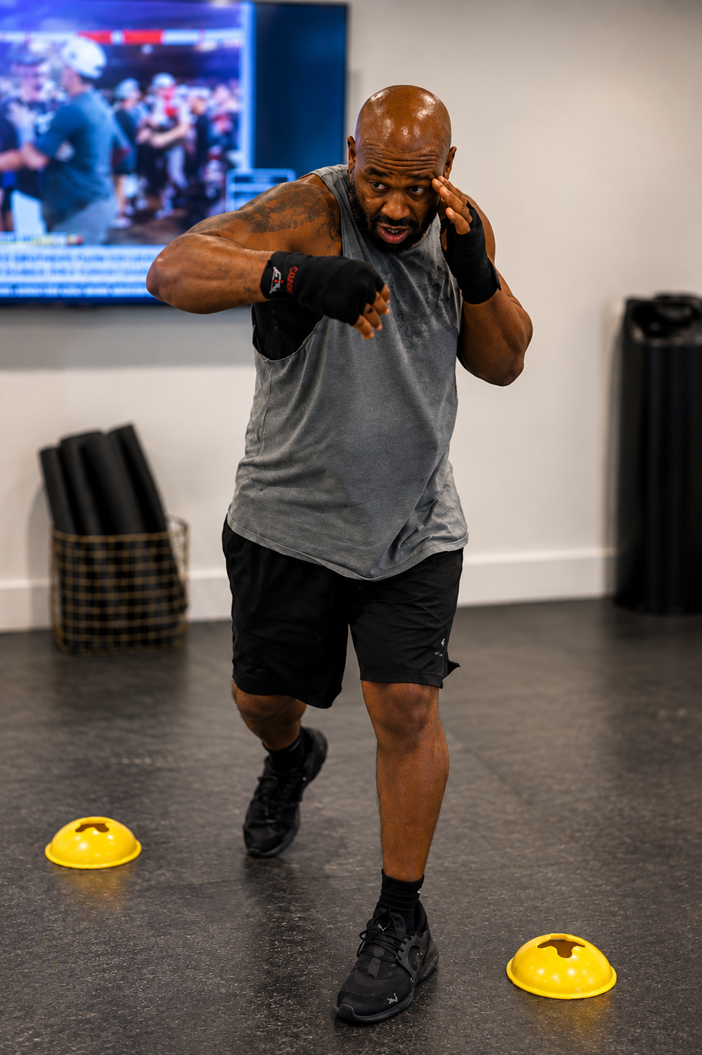 Camp BX fighter working footwork, agility cones, and boxing combinations