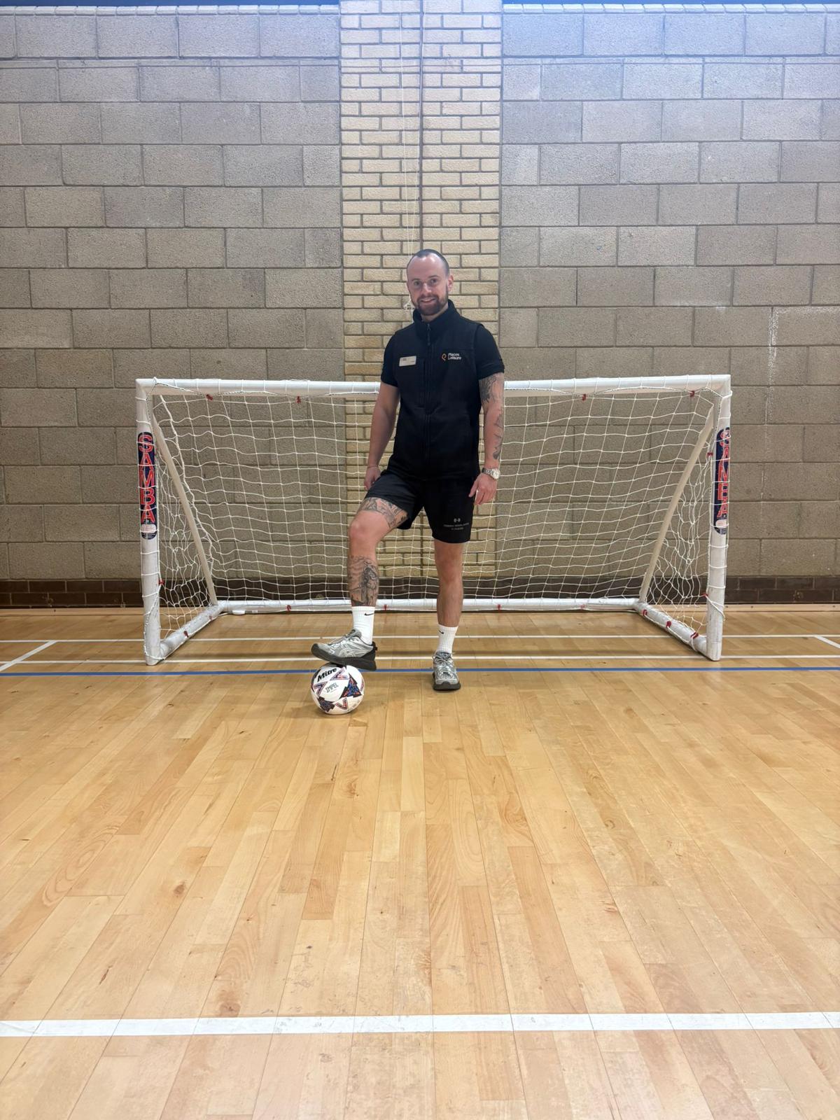Tommy Rowlands walking football coach with football at Loddon Valley Leisure Centre Reading Berkshire