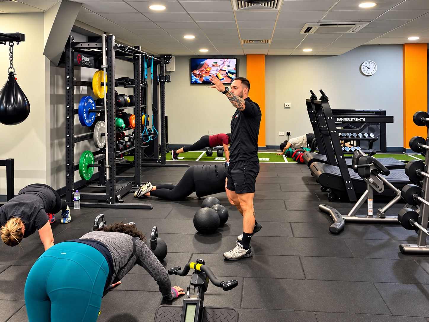 Circuit training class coached by Tommy Rowlands at Loddon Valley Leisure Centre in Reading with kettlebells, slam balls and conditioning stations