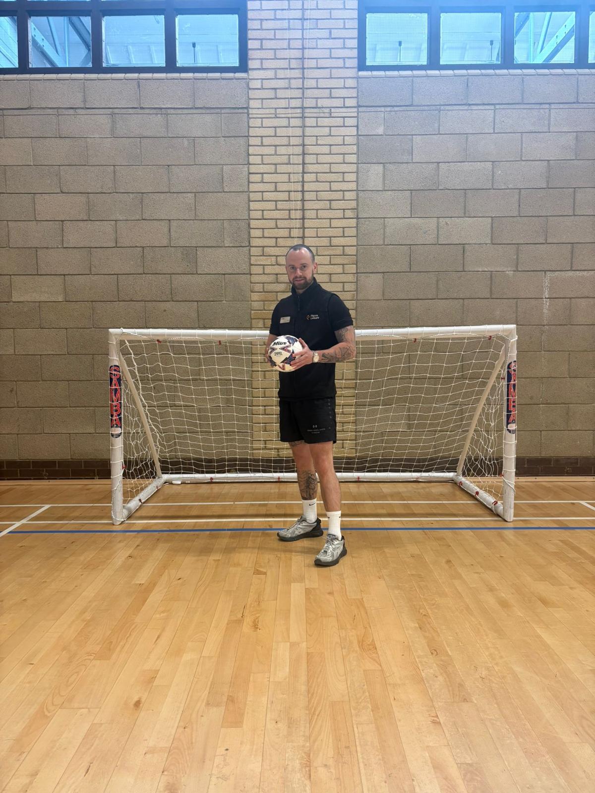 Tommy Rowlands coaching walking football in front of goals at Loddon Valley Leisure Centre Reading