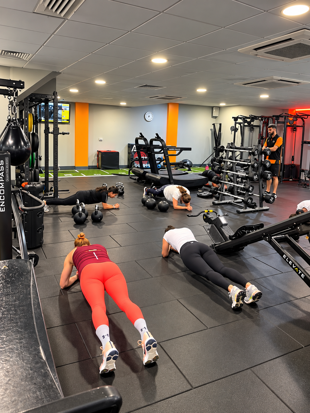 Tommy Rowlands supervising group core and plank conditioning stations on the gym floor at Loddon Valley Leisure Centre in Reading