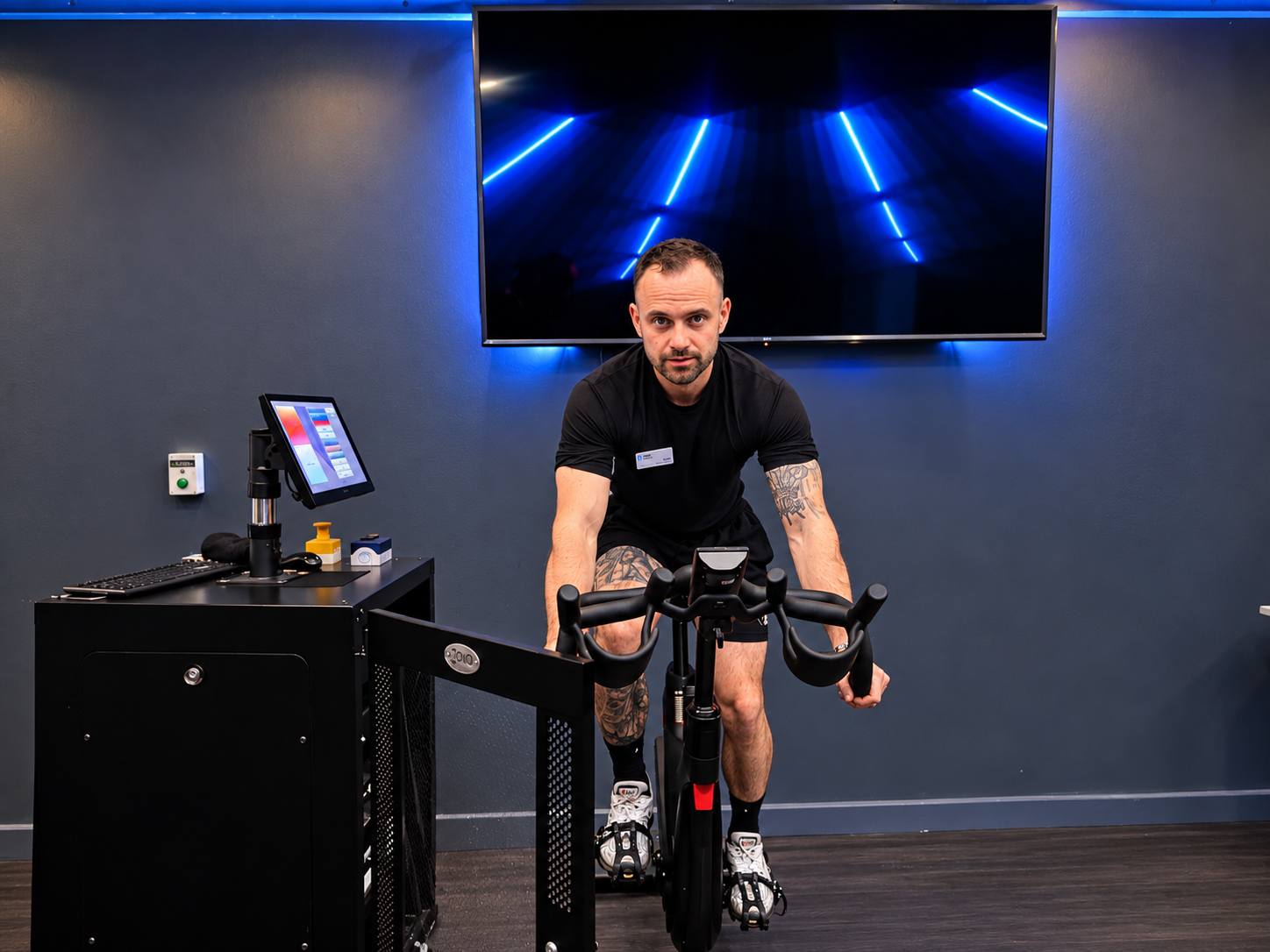 Tommy Rowlands coaching a spin class on the studio bike at Loddon Valley Leisure Centre in Reading, Berkshire