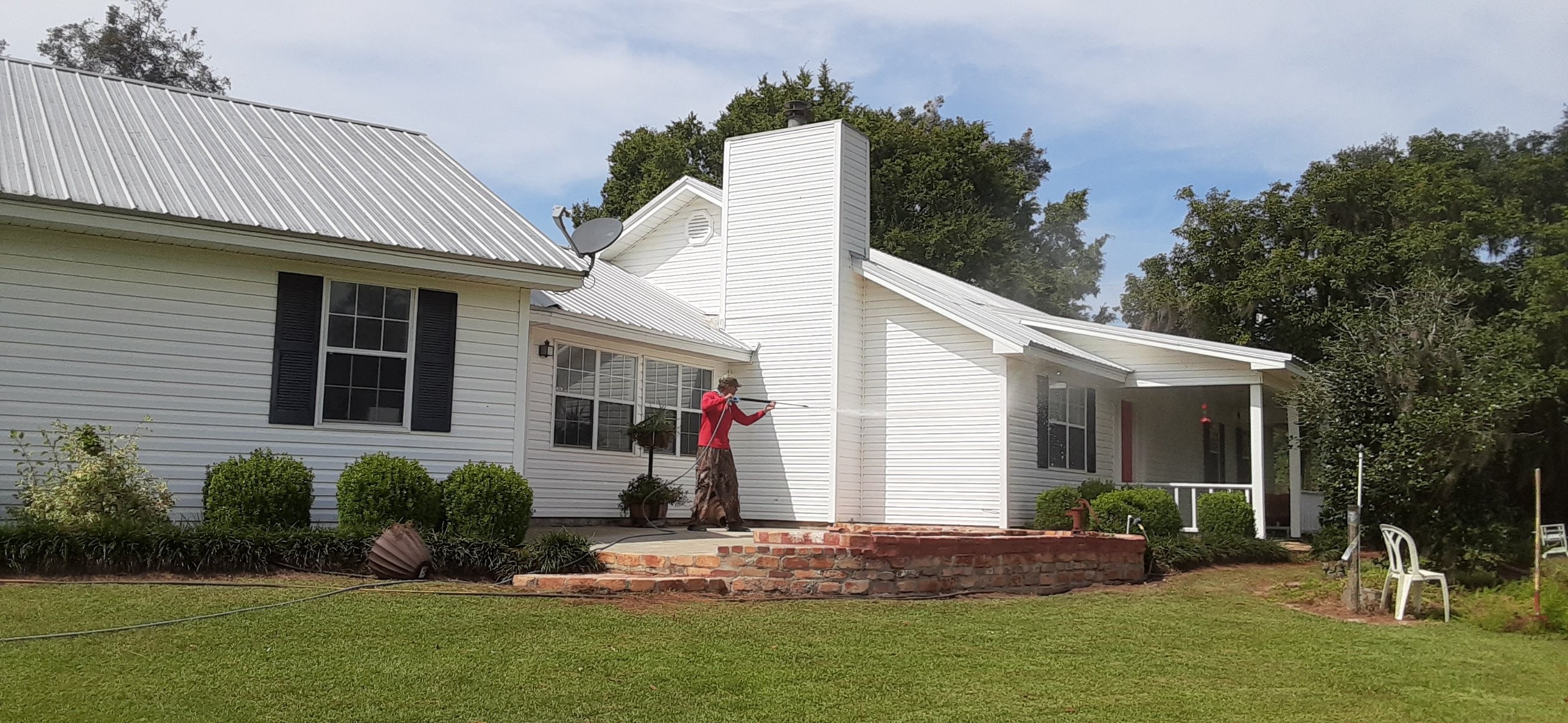 Mr Power Clean Pressure Washing washing exterior siding and chimney on a residential home in South Georgia